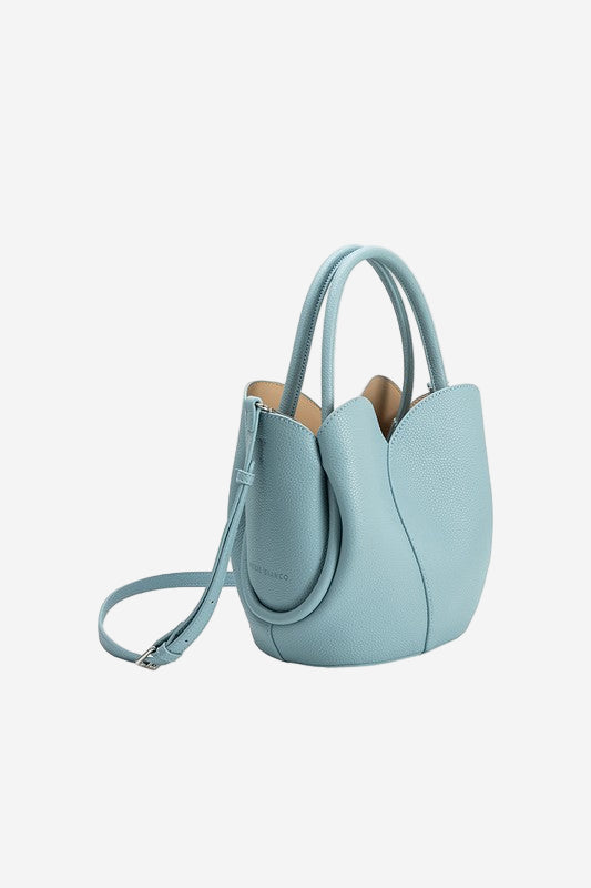 Light blue handbag with a strap on a white background