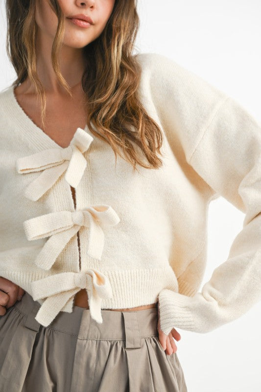 Bow & Tell Reversible Knit Sweater