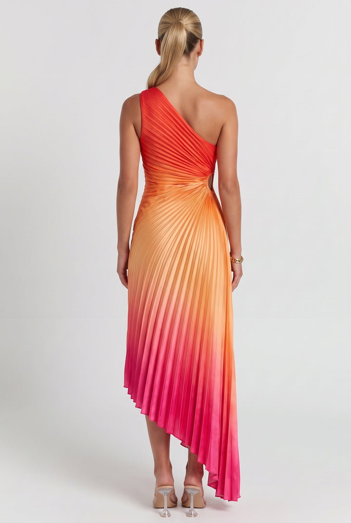 A woman modeling a one-shoulder pleated midi dress with a vibrant orange, yellow, and pink gradient, shown from the back against a light gray studio background.