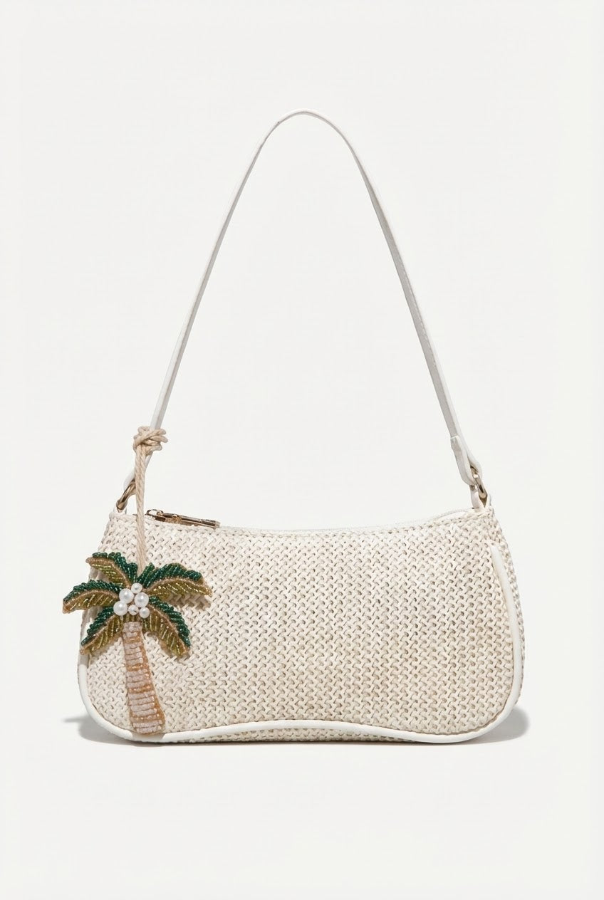 Woven handbag with palm tree design on a white background