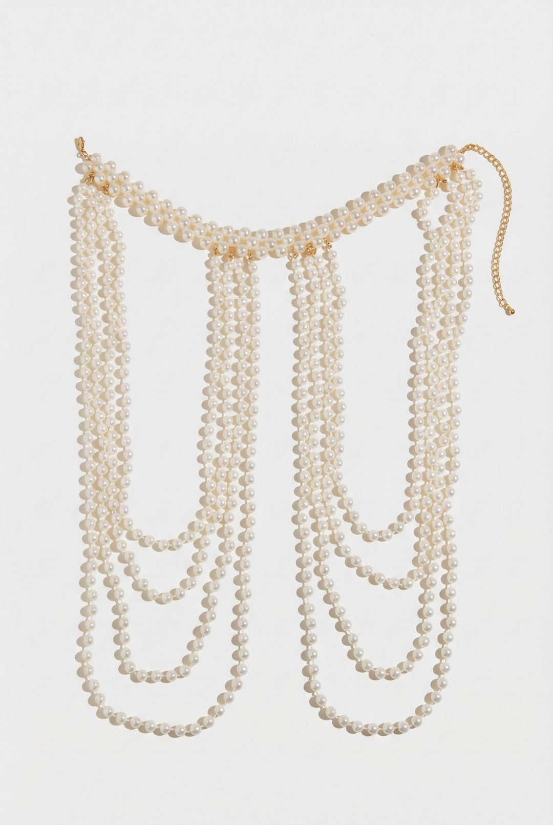 Long pearl necklace on a white background