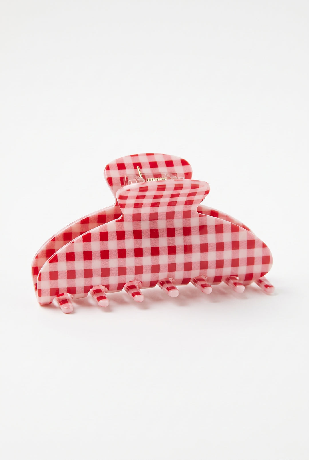 A large claw hair clip in a red and white gingham checkered pattern, photographed on a seamless white background.