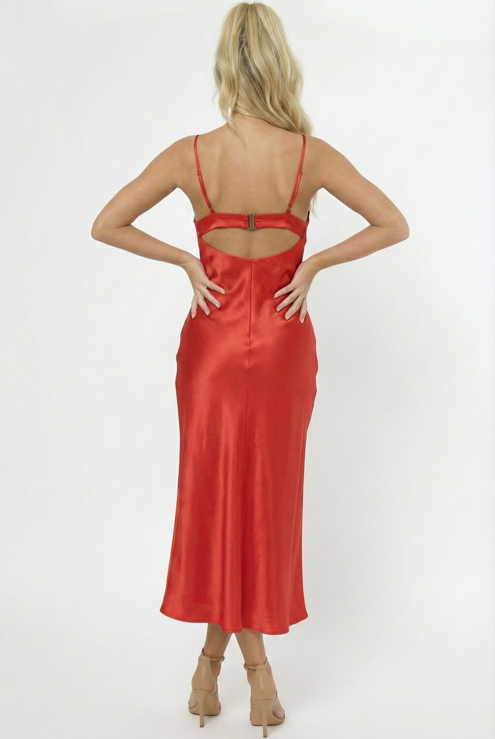 Red satin dress with cut-out back on a white background